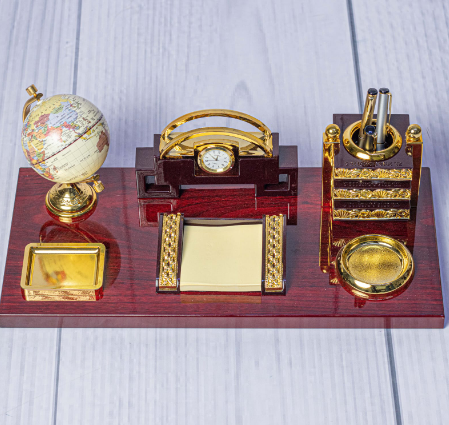 Custom laser-engraved luxury mahogany wooden executive desk organizer with gold globe by Print365 Kenya