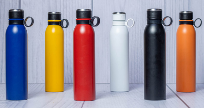 Display of powder-coated 1 Litre long steel thermal flasks in red white blue orange yellow black by Print365 Kenya