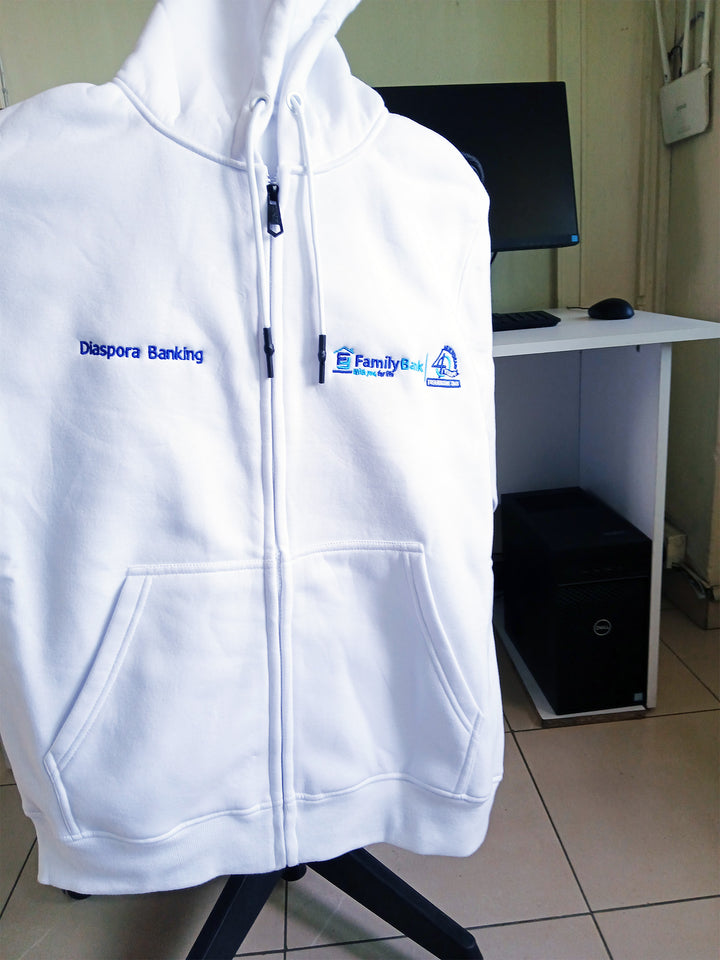 White hoodie with logos on a mannequin in an office setting