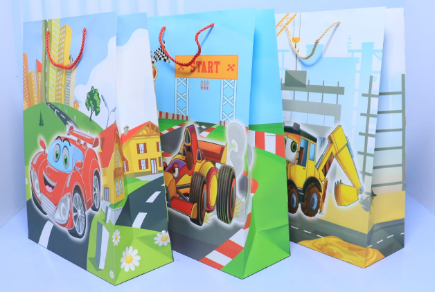 Fun kids birthday A3 paper gift bags with race car and construction digger graphics priced at Ksh 400 in Nairobi