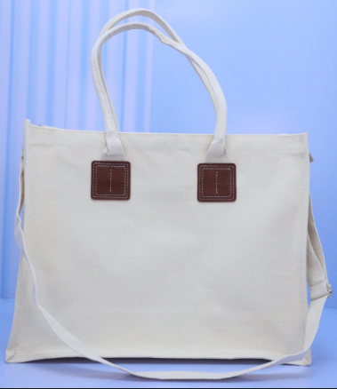 Natural cream landscape A3 canvas tote bag with brown PU leather handle patches priced at Ksh 1200 in Nairobi