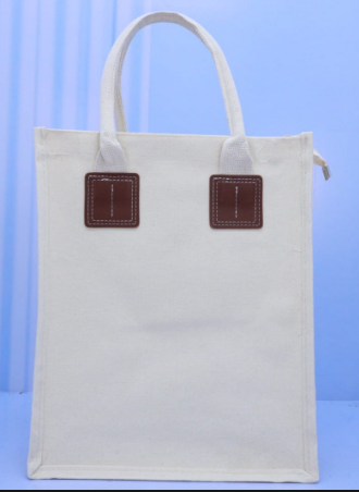Natural cream vertical A4 portrait canvas bag with brown PU leather handle patches priced at Ksh 1100 in Nairobi