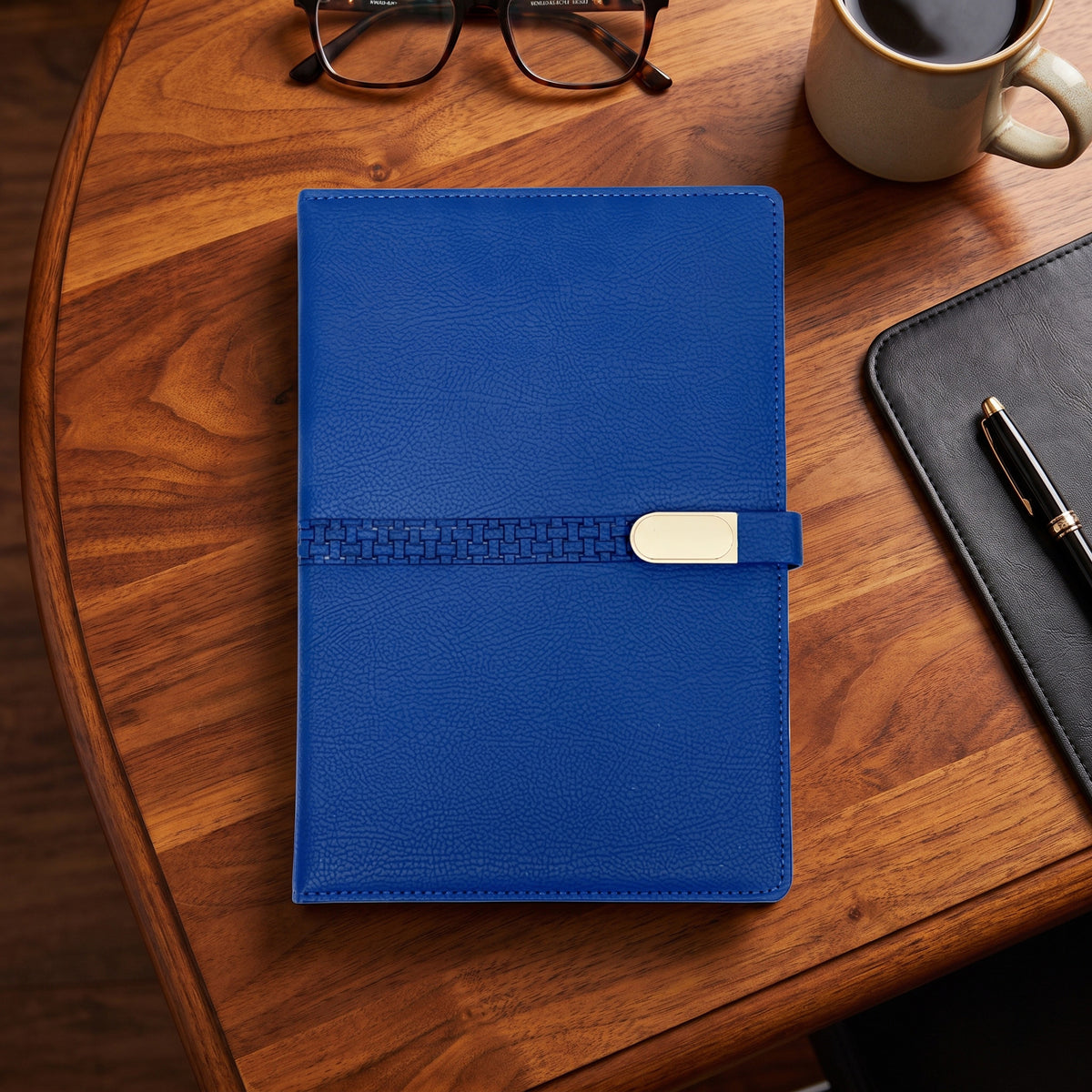Custom debossed executive A4 royal blue leatherette notebook with woven band by Print365 Kenya