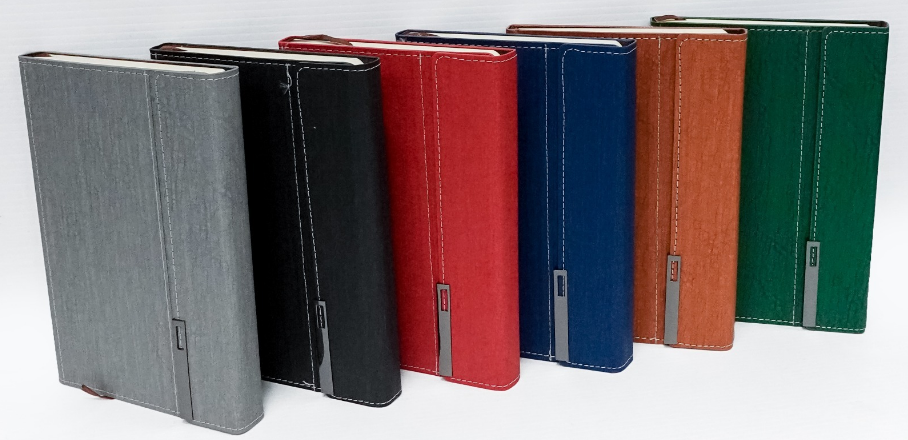 Custom debossed A5 executive leatherette notebooks with vertical metallic clip flaps by Print365 Kenya