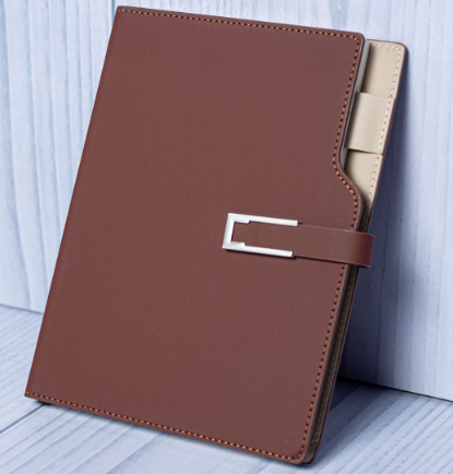 Custom laser-engraved executive A5 notched leatherette notebook with silver metal buckle by Print365 Kenya