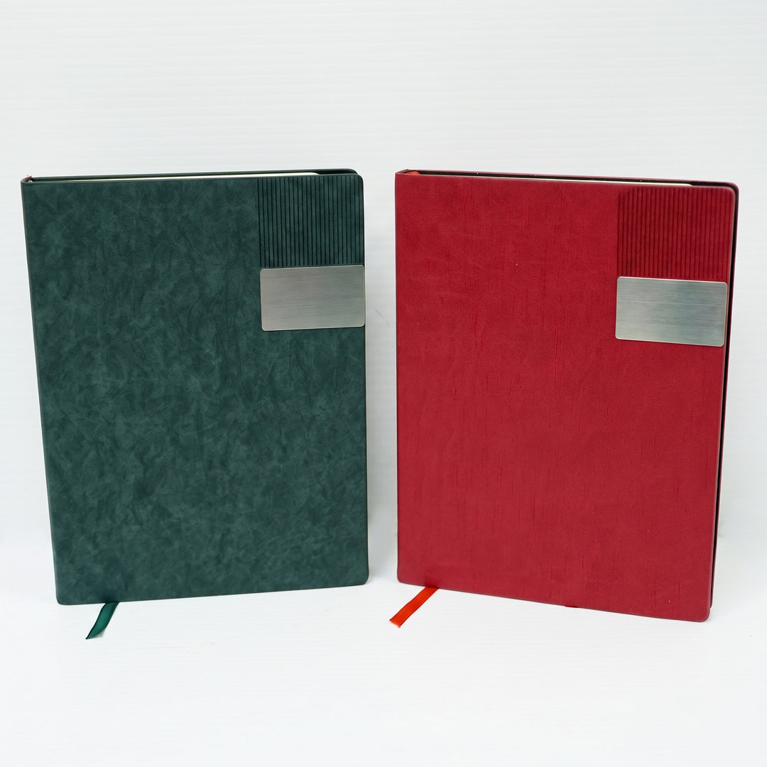 Custom debossed A5 leatherette notebooks with silver metal badge plate by Print365 Kenya