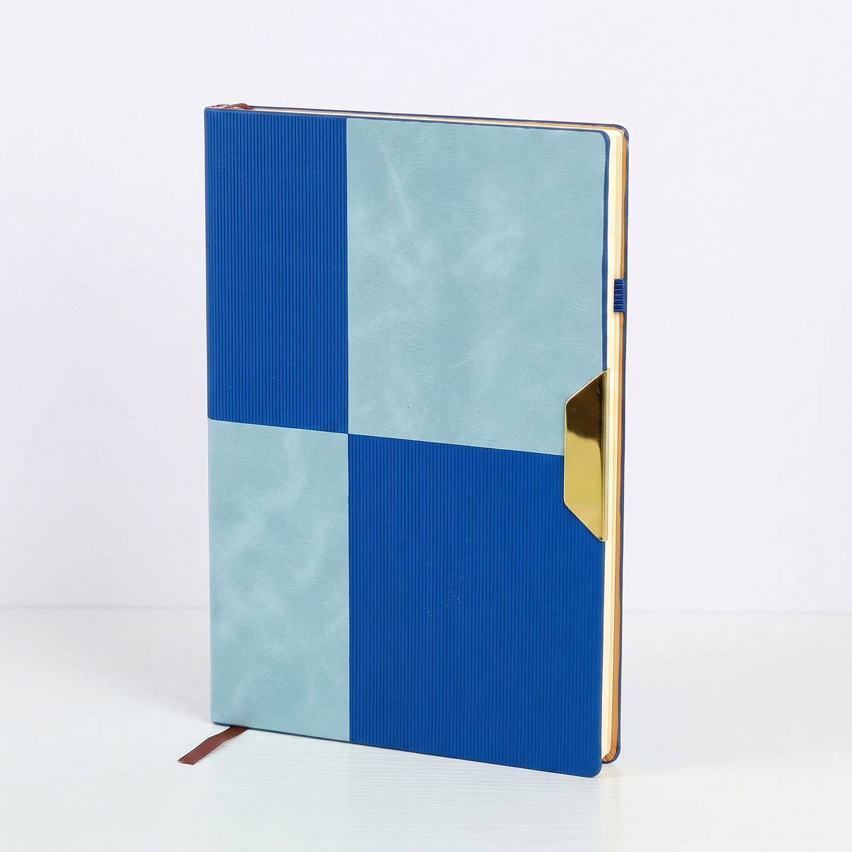 Custom branded A5 dual-texture color-block notebook with gold accent tab in Nairobi