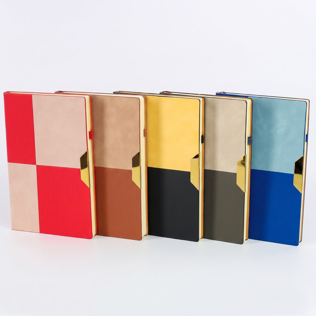 Custom debossed A5 color-block leatherette notebooks with gold metallic tabs by Print365 Kenya