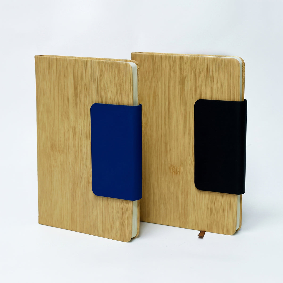 Custom laser-engraved A5 natural bamboo notebooks with blue and black magnetic flap closures by Print365 Kenya