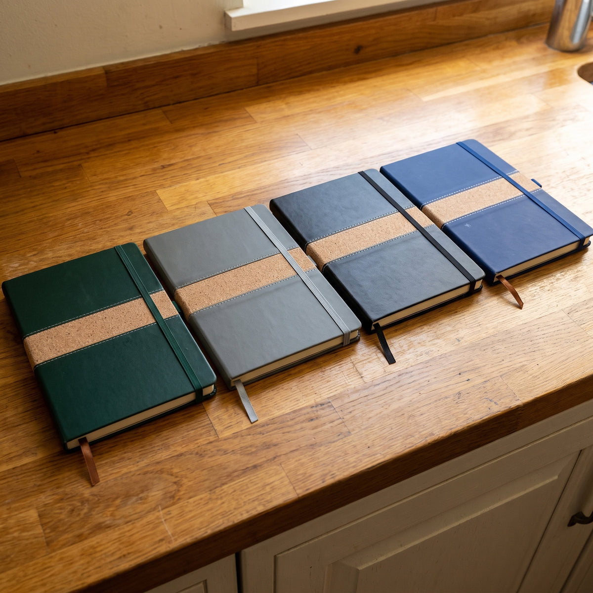 Custom branded A5 leatherette notebooks with stitched cork accent bands in Nairobi