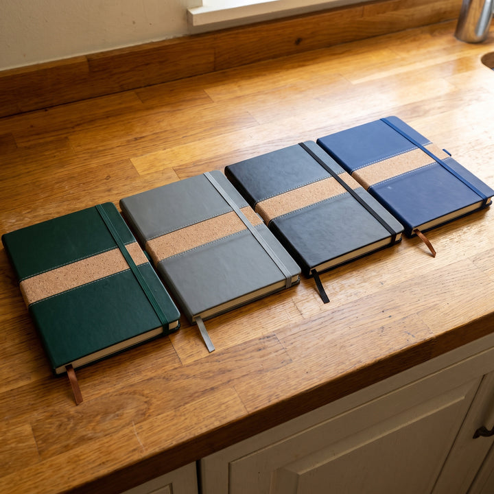 Custom branded A5 leatherette notebooks with stitched cork accent bands in Nairobi