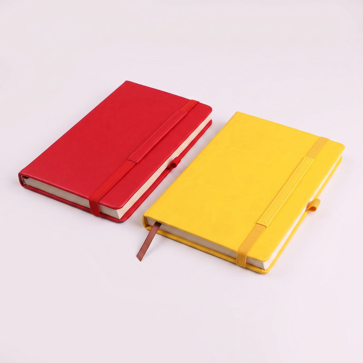 Custom branded A5 leatherette notebooks with elastic band and stitched loops in Nairobi