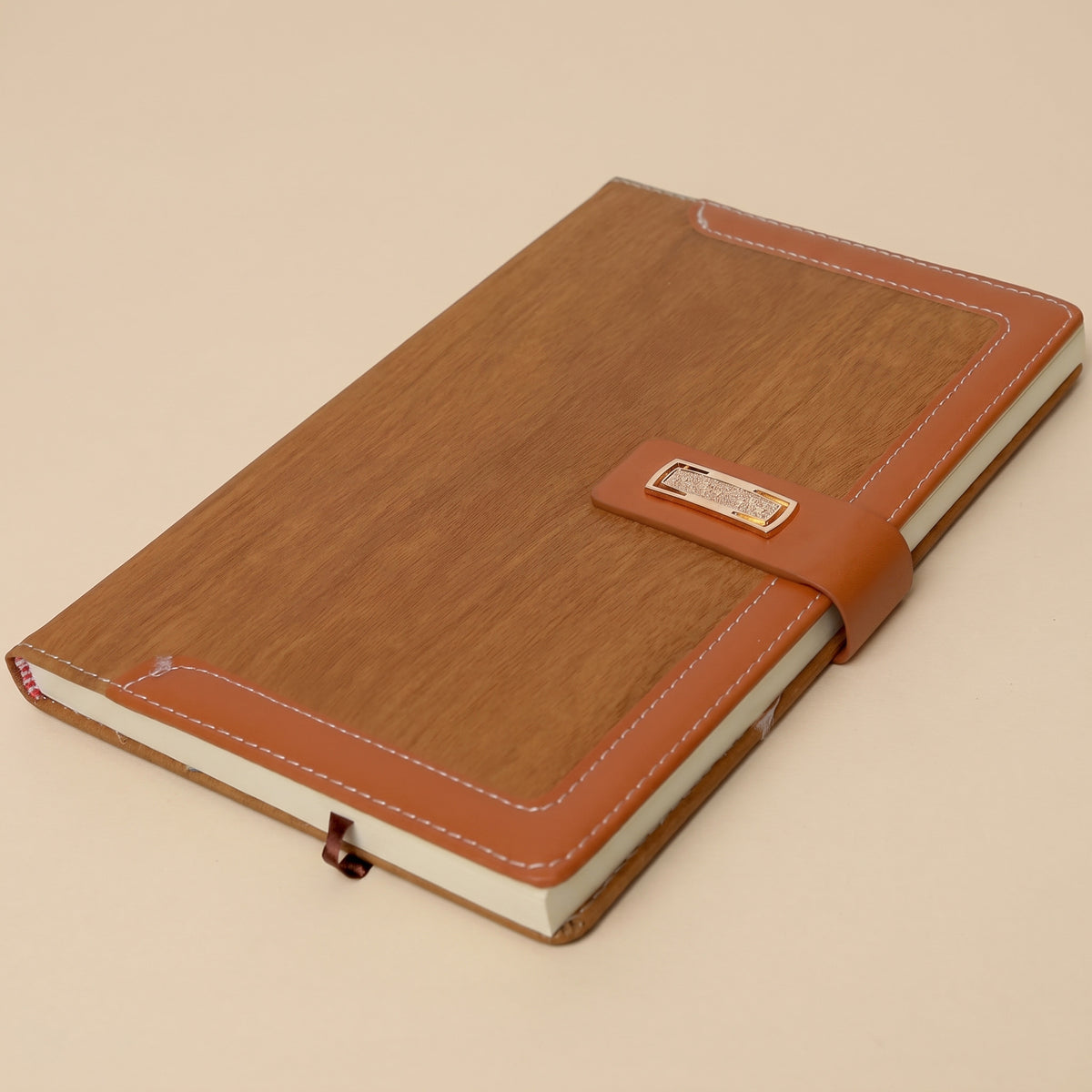 Custom branded A5 wood-grain leatherette notebook with ornate metallic clasp in Nairobi