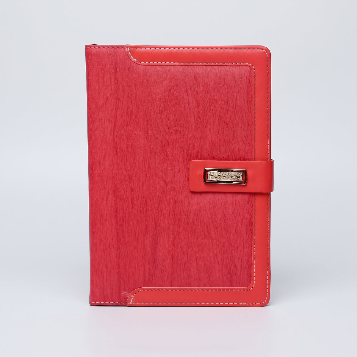 Custom debossed A5 red wood-grain leatherette notebook with contrast stitching by Print365 Kenya