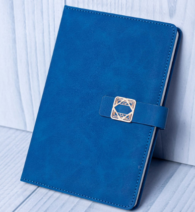 Custom laser-engraved A5 soft-touch leatherette notebook with geometric gold buckle strap by Print365 Kenya