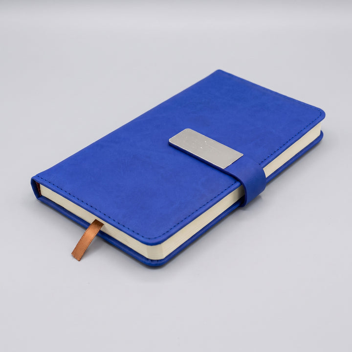 Custom debossed pocket-size A6 blue leatherette notebook with silver metal clasp by Print365 Kenya