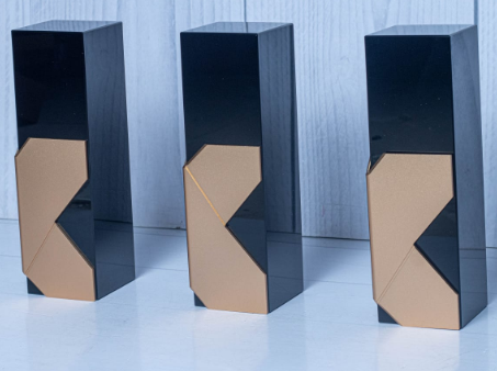 Custom laser-engraved piano black and geometric gold monolith award trophy by Print365 Kenya