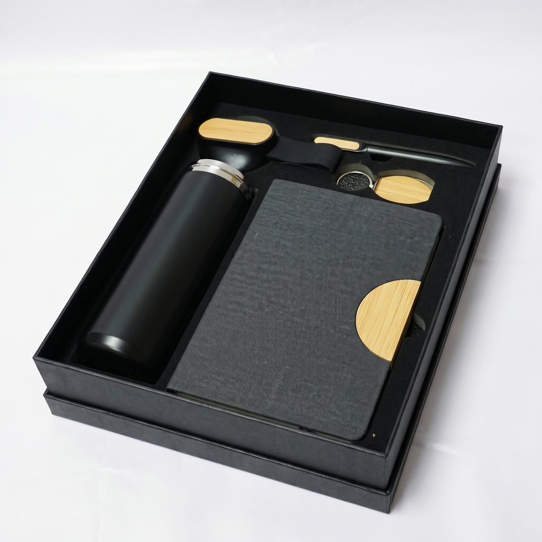 Custom laser-engraved 4-piece executive gift set in matte black and natural bamboo by Print365 Kenya