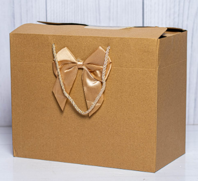 Custom branded classy gold kraft landscape gift bag with satin bow by Print365 Kenya