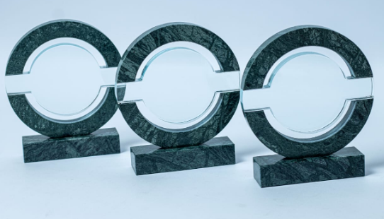 Custom laser-engraved bisected green marble and clear glass circular award trophy by Print365 Kenya