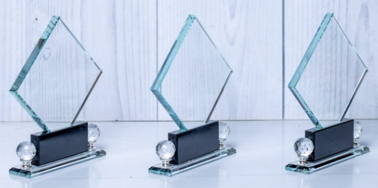 Custom laser-engraved diamond crystal award trophy with dual gem spheres by Print365 Kenya
