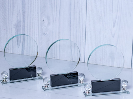 Custom laser-engraved circular crystal award trophy with dual crystal gem accents by Print365 Kenya