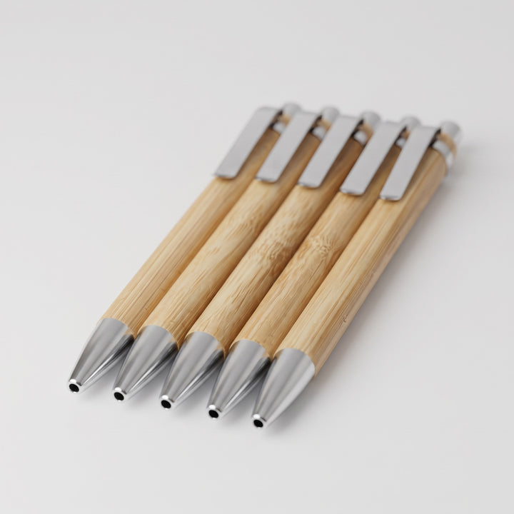 Custom laser-engraved eco-friendly bamboo ballpoint pens with silver trim by Print365 Kenya
