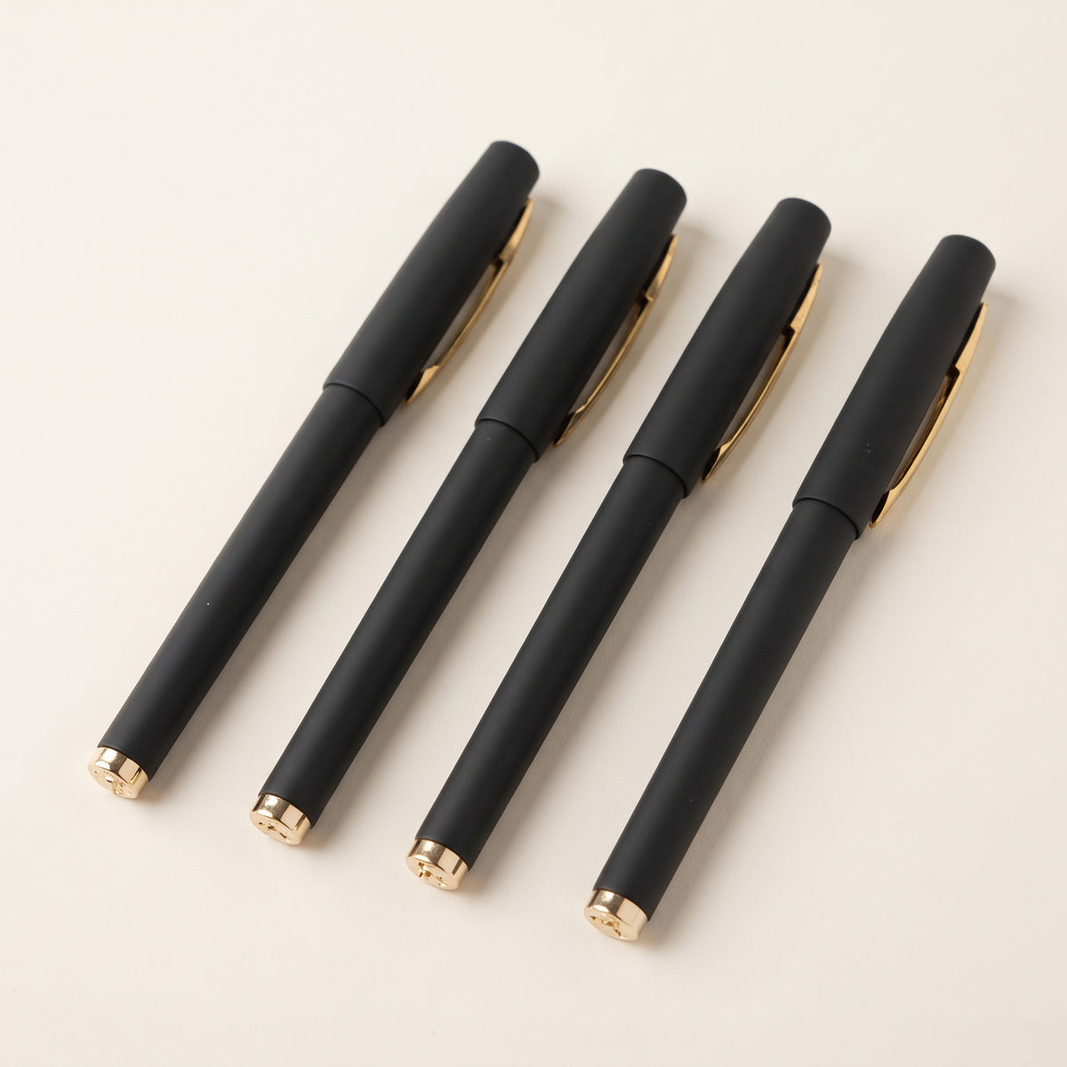 Custom laser-engraved executive matte black pens with gold trim by Print365 Kenya