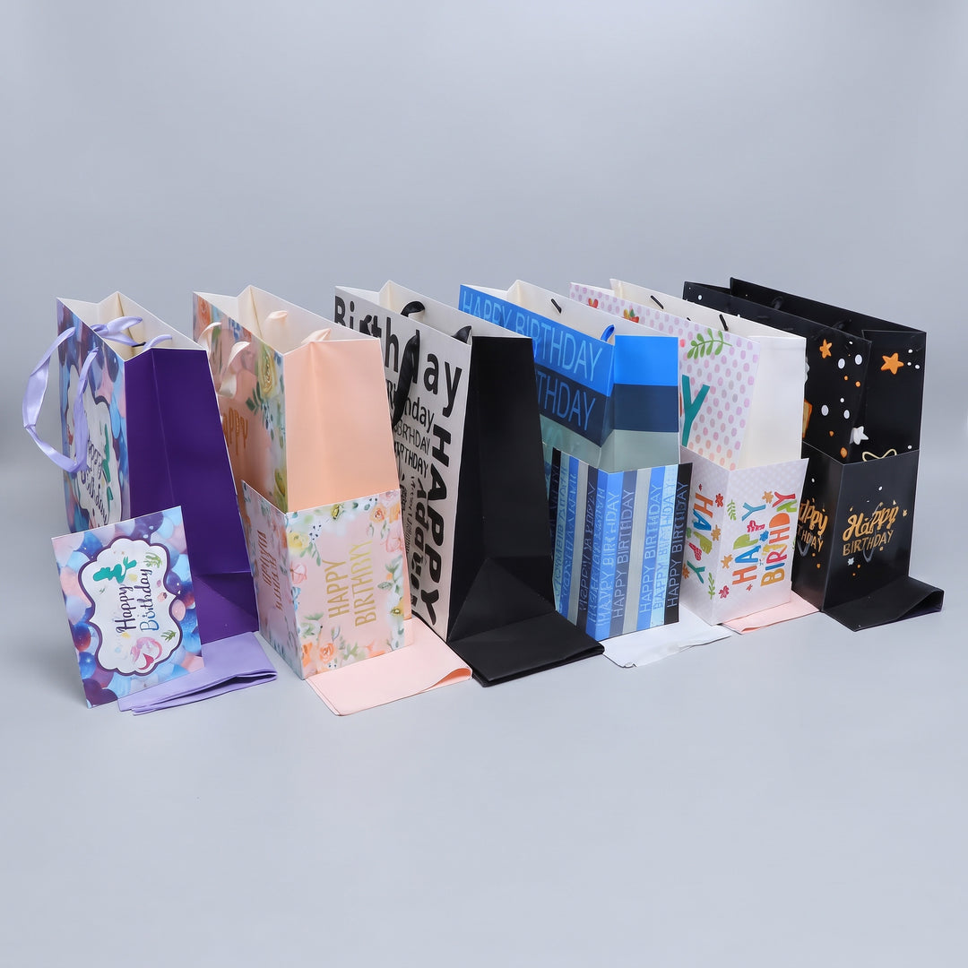 Premium A4 birthday gift bags in colorful floral, typographic, and starry black designs priced at Ksh 500 in Nairobi