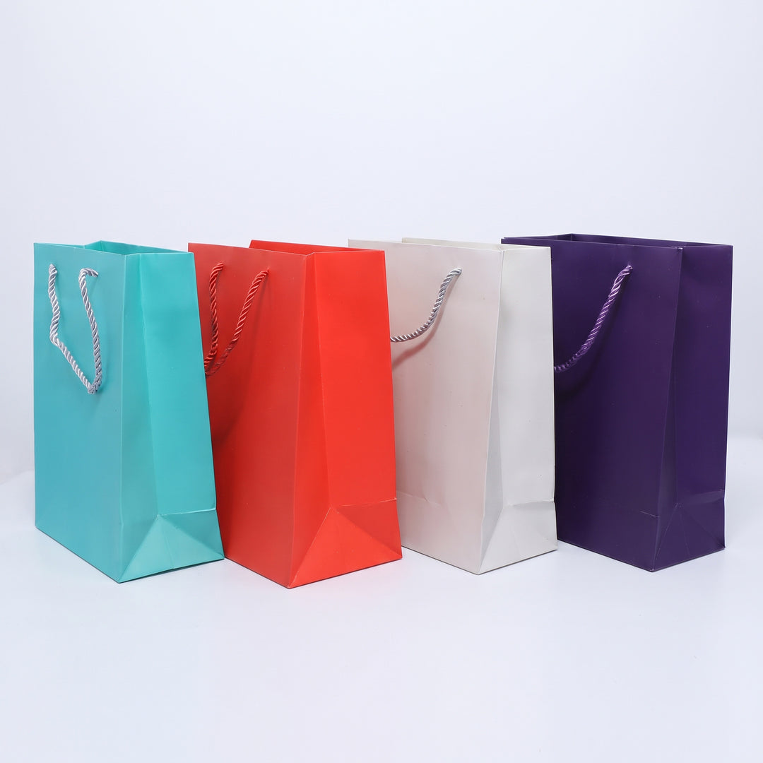 Executive B5 mid-size paper gift bags in cyan red cream purple priced at Ksh 300 in Nairobi