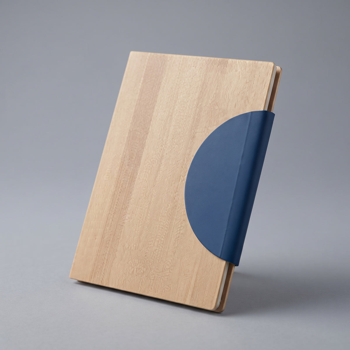 Custom laser-engraved A5 bamboo notebook with blue half-moon magnetic flap by Print365 Kenya