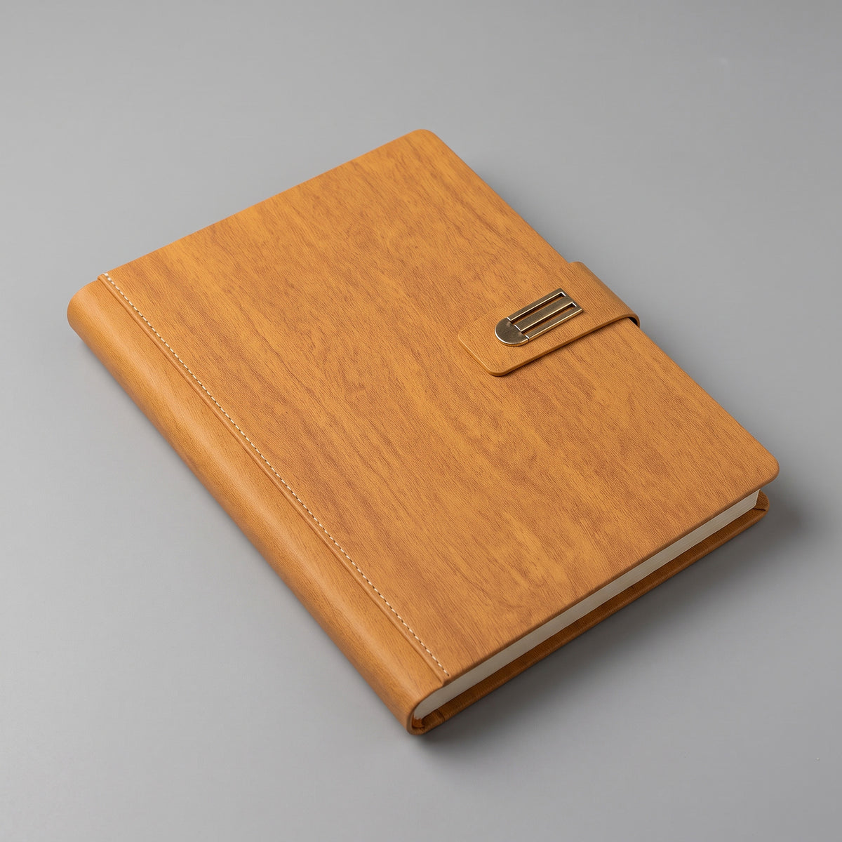 Custom debossed executive A5 tan brown leatherette notebook with antique buckle by Print365 Kenya