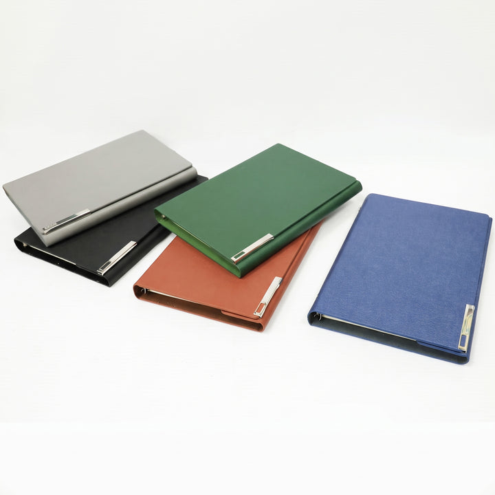 Corporate promotional stationery display featuring custom leatherette notebooks with silver bar accents in Nairobi