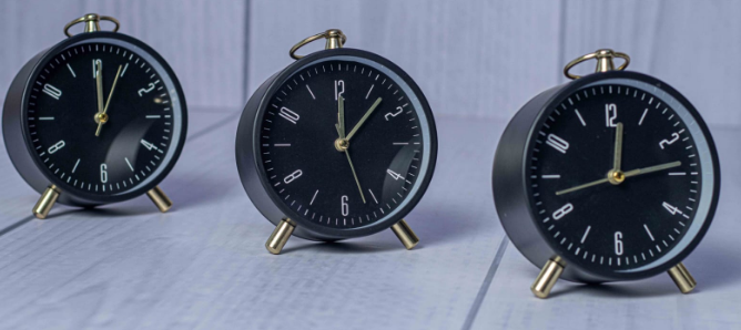 Custom laser-printed vintage black desk clock with gold ring loop and peg legs by Print365 Kenya