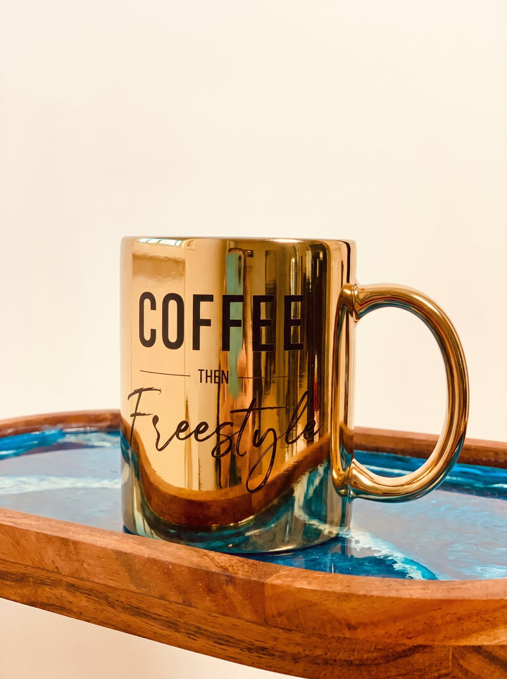 A custom metallic gold ceramic coffee mug with the text &