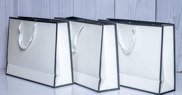 Custom printed luxury white A4 landscape paper gift bag with black border trim by Print365 Kenya