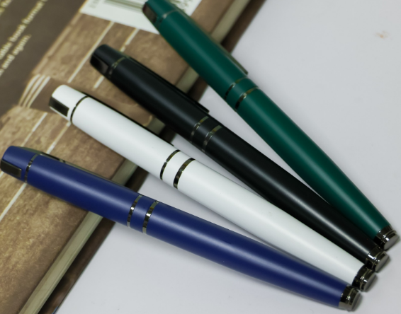 Custom laser-engraved executive matte metal pens with dual chrome collar rings by Print365 Kenya