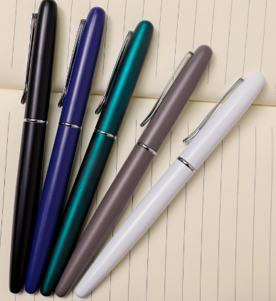 Custom laser-engraved executive satin metal pens with silver clip accents by Print365 Kenya
