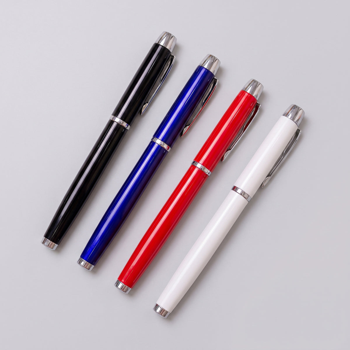 Custom laser-engraved executive metal pens with silver chrome trim accents by Print365 Kenya