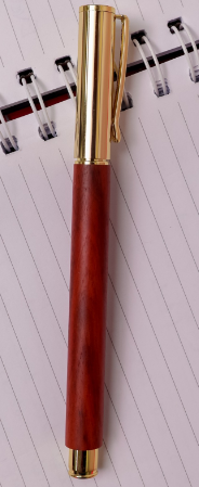 Custom laser-engraved executive mahogany wooden pen with gold cap by Print365 Kenya