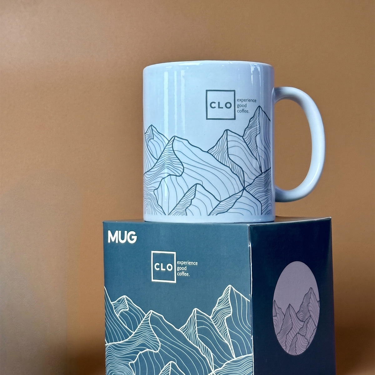 Close-up of vibrant full-color sublimation logo print on an 11oz ceramic mug with box done in Nairobi