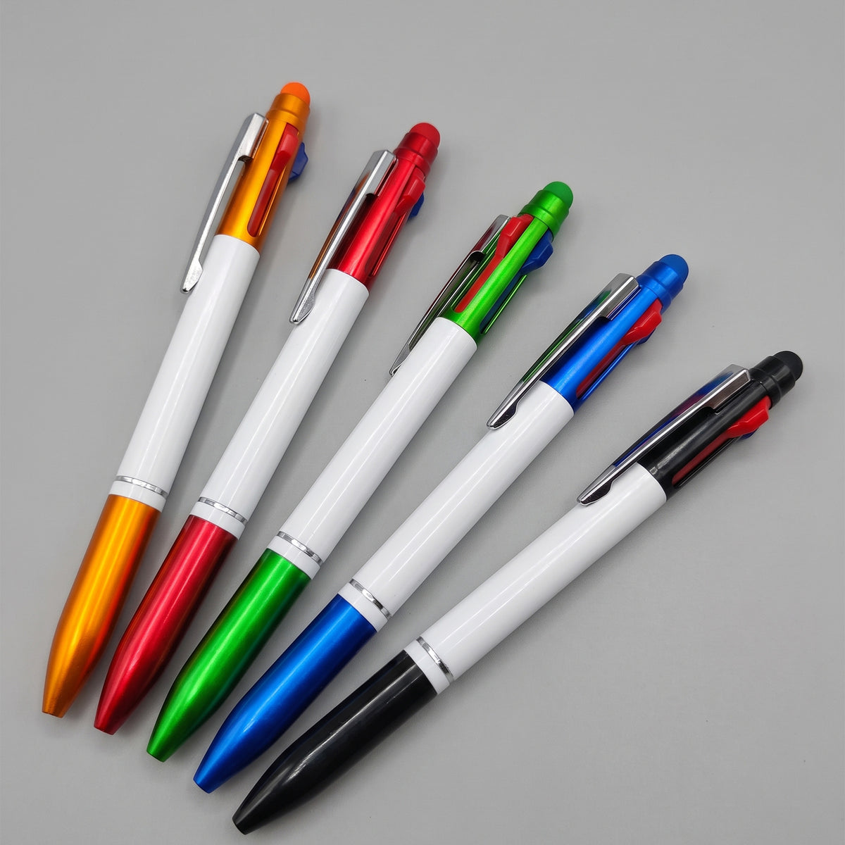 Custom printed 3-in-1 shuttle pens with multi-color ink by Print365 Kenya
