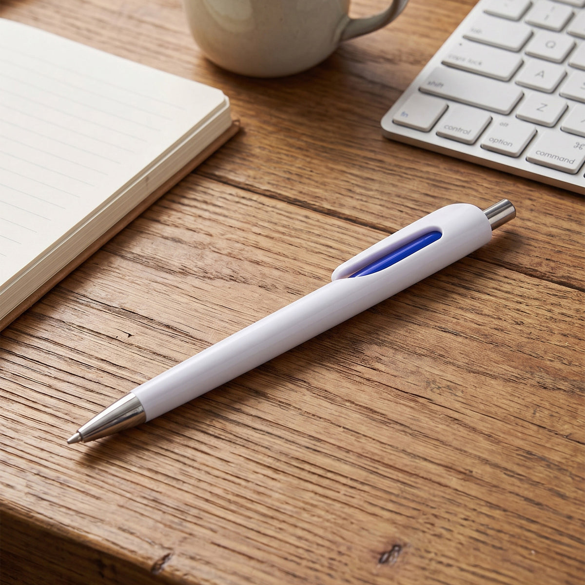 Promotional white plastic ballpoint pen featuring polished chrome trim and metallic clip done in nairobi Kenya