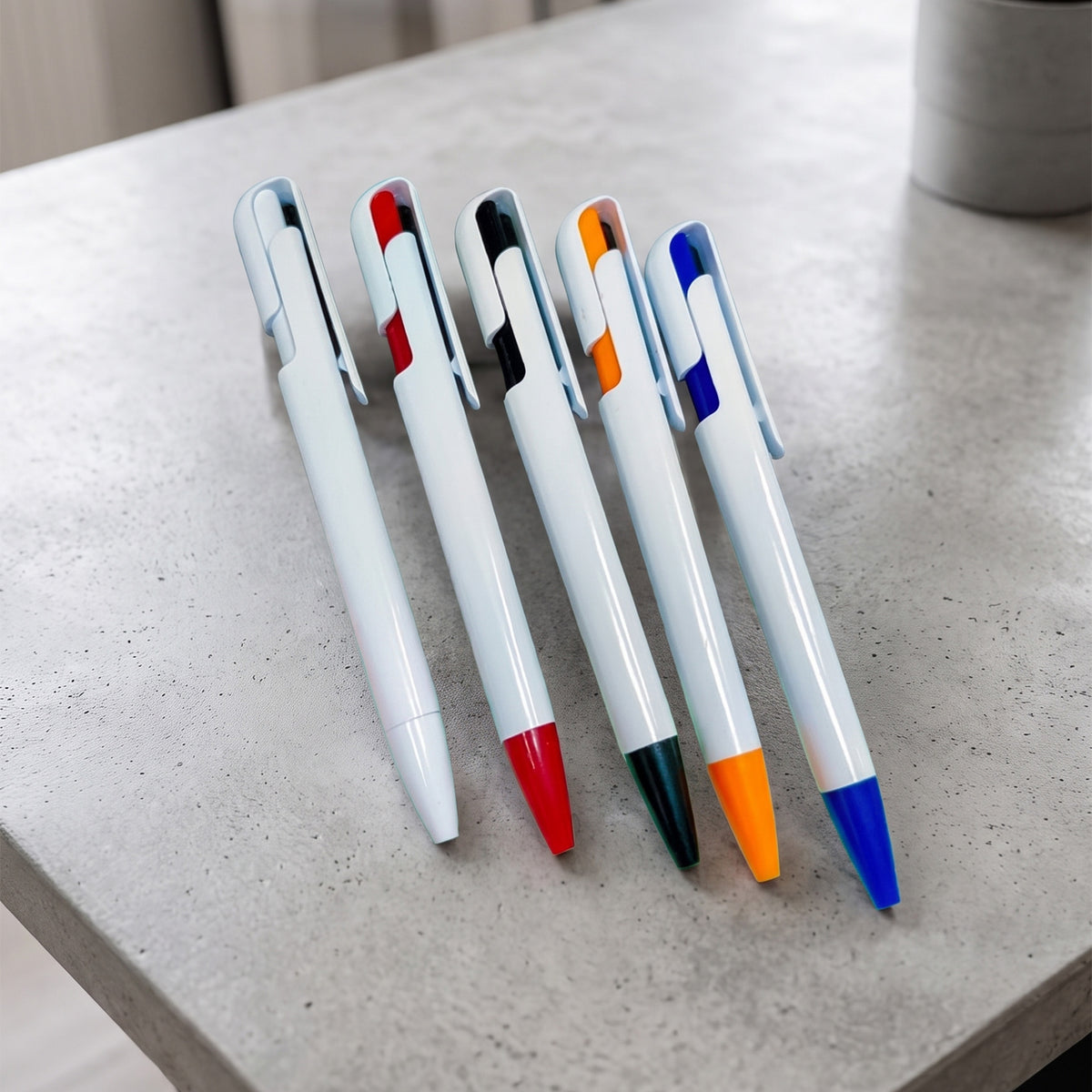Custom printed white promotional plastic pens with colored tip accents by Print365 Kenya