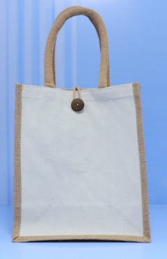 Natural burlap vertical portrait jute tote bag with white canvas panel and wooden button priced at Ksh 700 and Ksh 1000 in Nairobi