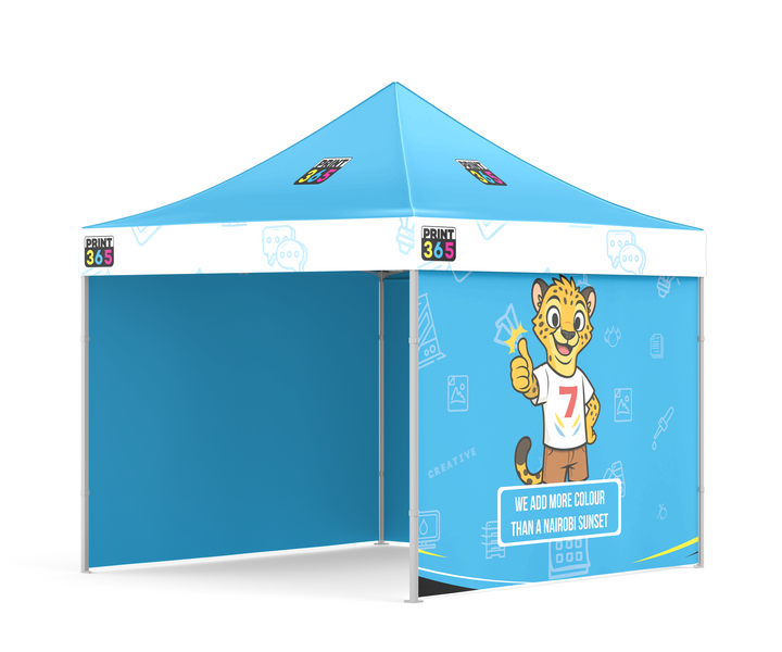 A pop-up display tent with a bright blue roof and side panels, featuring custom printed graphics of a cartoon lion cub by Print365 Nairobi