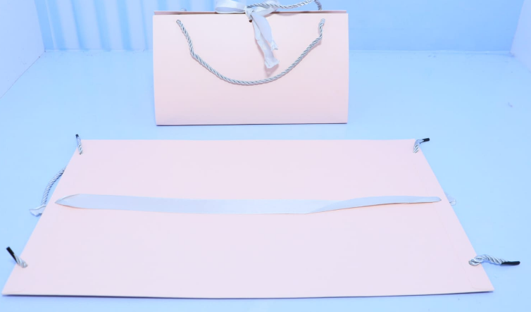 Luxury envelope purse style folding paper gift bag with satin ribbon bow priced at Ksh 400 in Nairobi