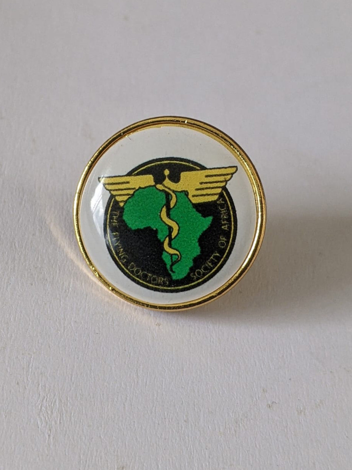 Custom laser-printed small round lapel pin 2cm with smooth gold rim by Print365 Kenya