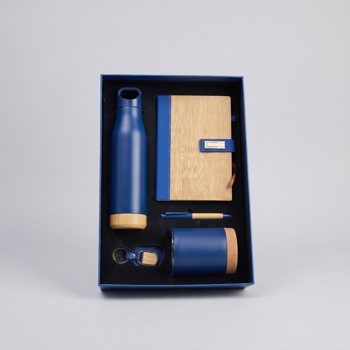 Custom laser-engraved 5-piece executive gift set in royal blue and natural wood by Print365 Kenya