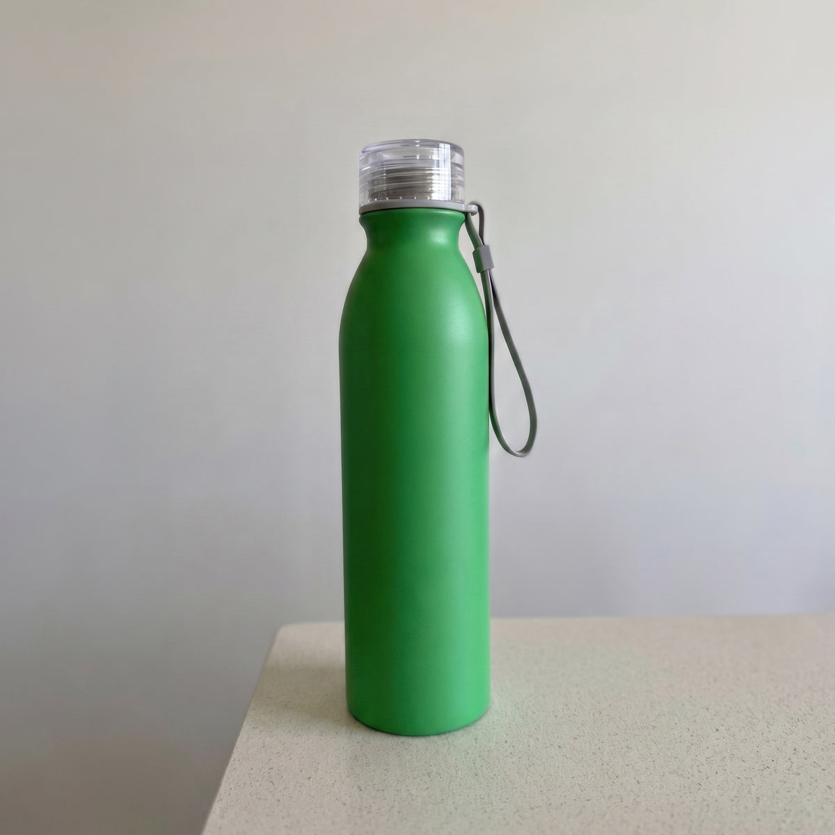 Custom laser-engraved vibrant green thermal vacuum flask with grey silicone strap by Print365 Kenya
